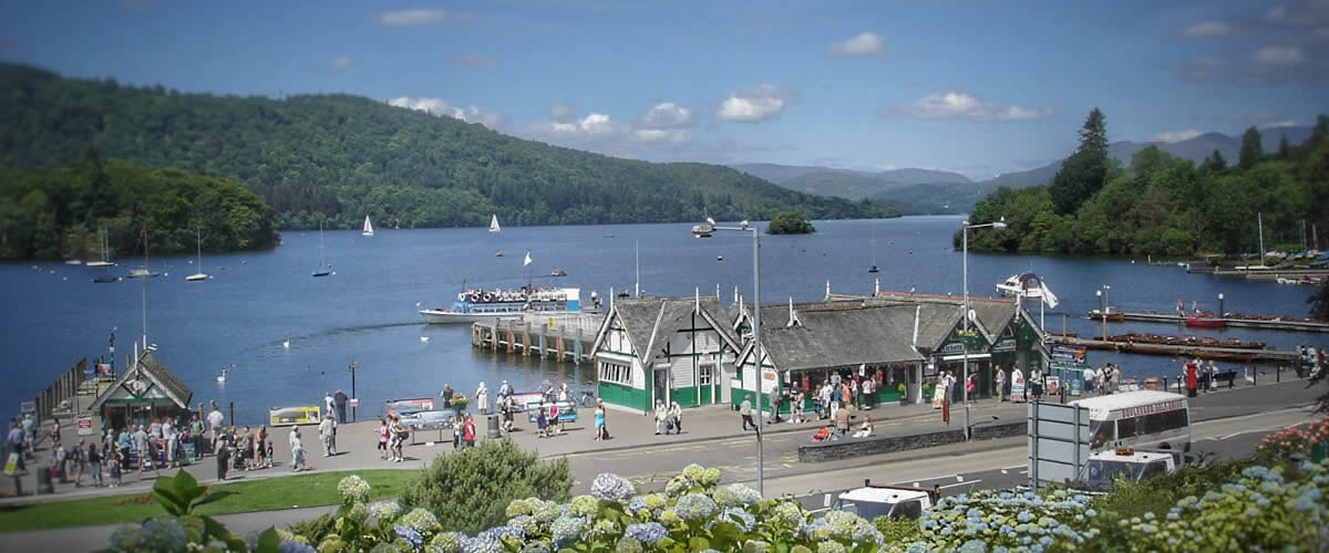 Boats and the pier at Bowness-on-Windermere on a sunny day